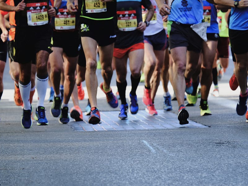 Runner celebrating finishing a race