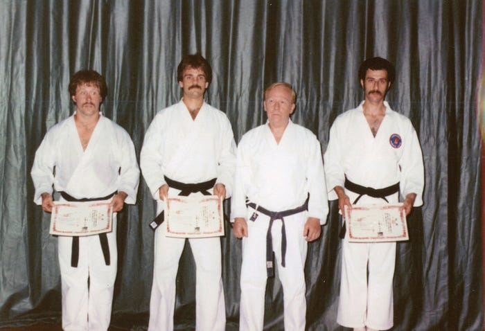 A cherished memory of David Bretz and me after earning our black belts.