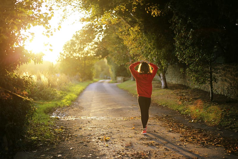 Scenic view of a runner on a path